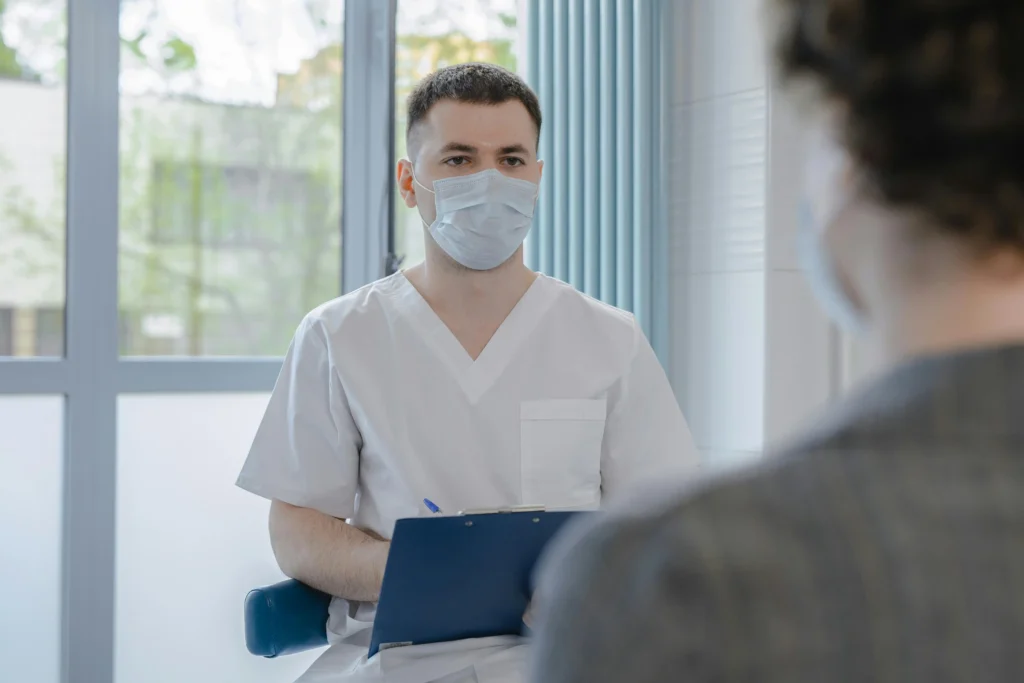 Doctor consulting with a patient during a hormone therapy appointment discussing how much is TRT and available treatment options.