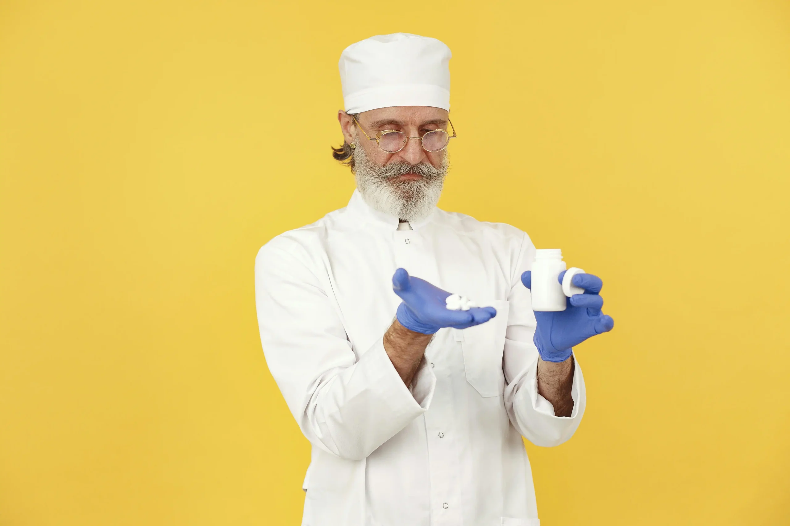 Man comparing a prescription testosterone vial and a bottle of natural testosterone booster supplements on a kitchen counter, illustrating the choice between TRT vs testosterone boosters.