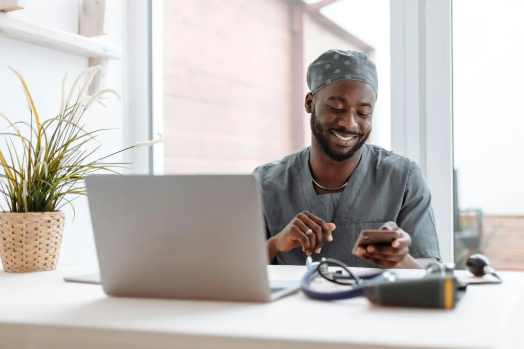 Medical professional at a workstation, exploring information related to TRT Nation and hormone replacement treatment.