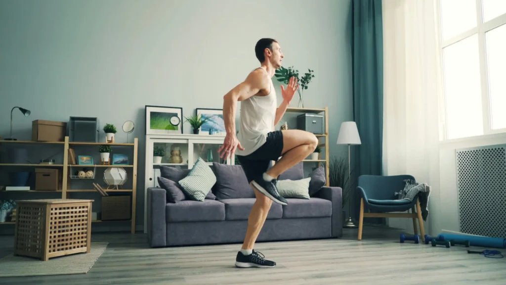 Fitness enthusiast exercising in a living room as part of a healthy lifestyle often associated with hone vs trt nation wellness programs.