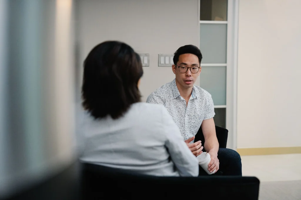 Patient discussing hormone therapy with a healthcare provider during a consultation about hcg on testosterone.