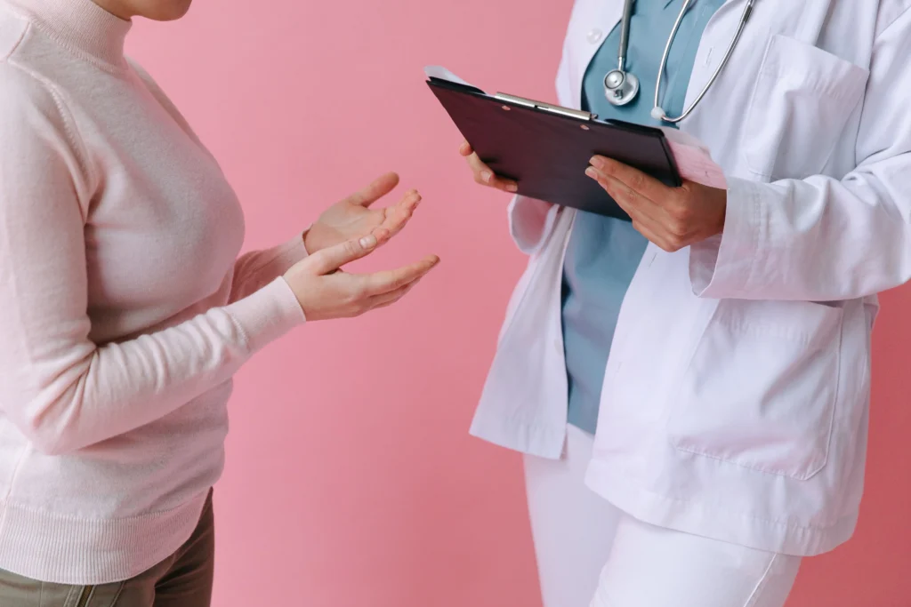 Patient discussing treatment options with a healthcare provider during a consultation, highlighting factors that may influence Henry Meds cost and personalized weight management plans.