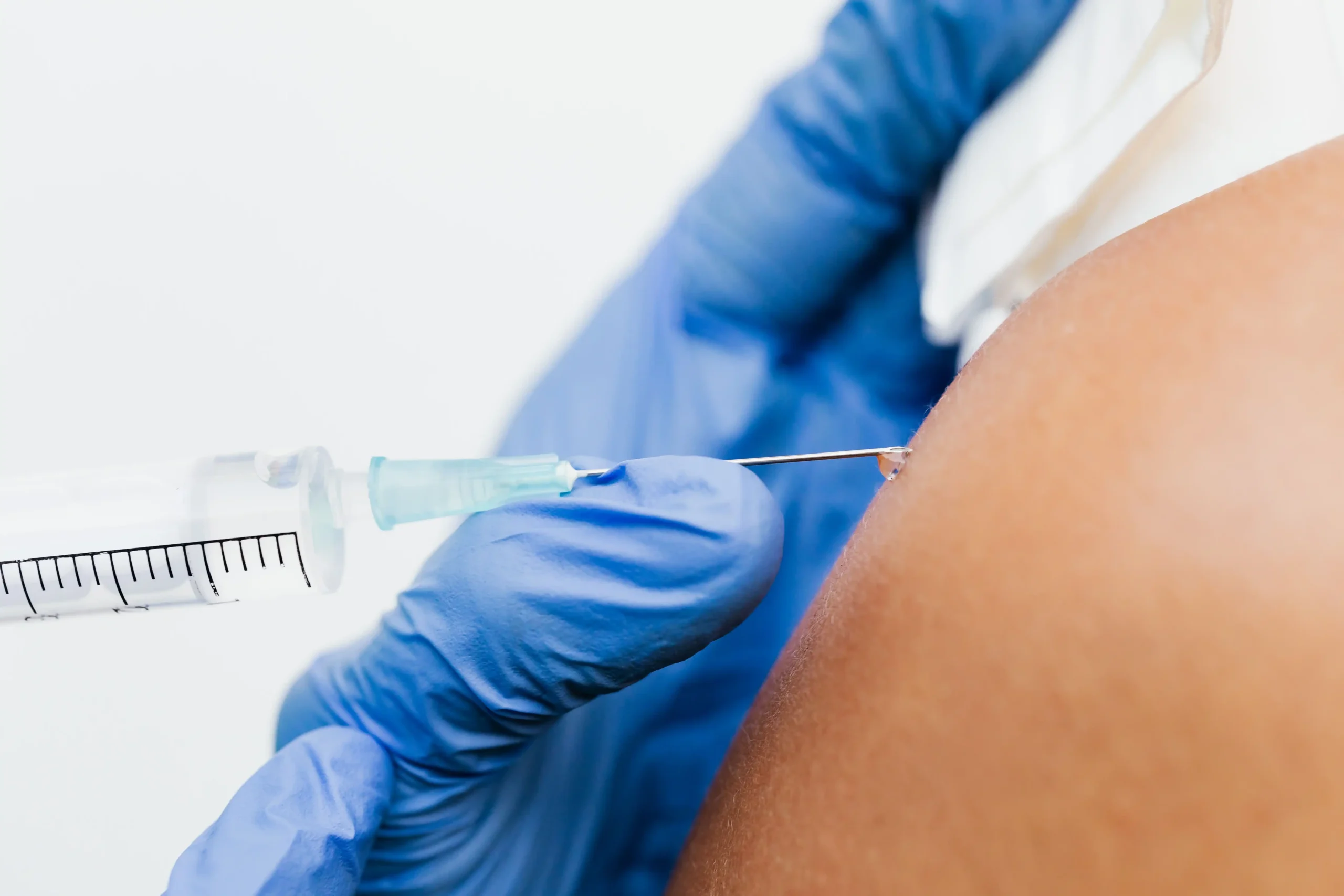 A clinician administering a treatment during a clinical appointment