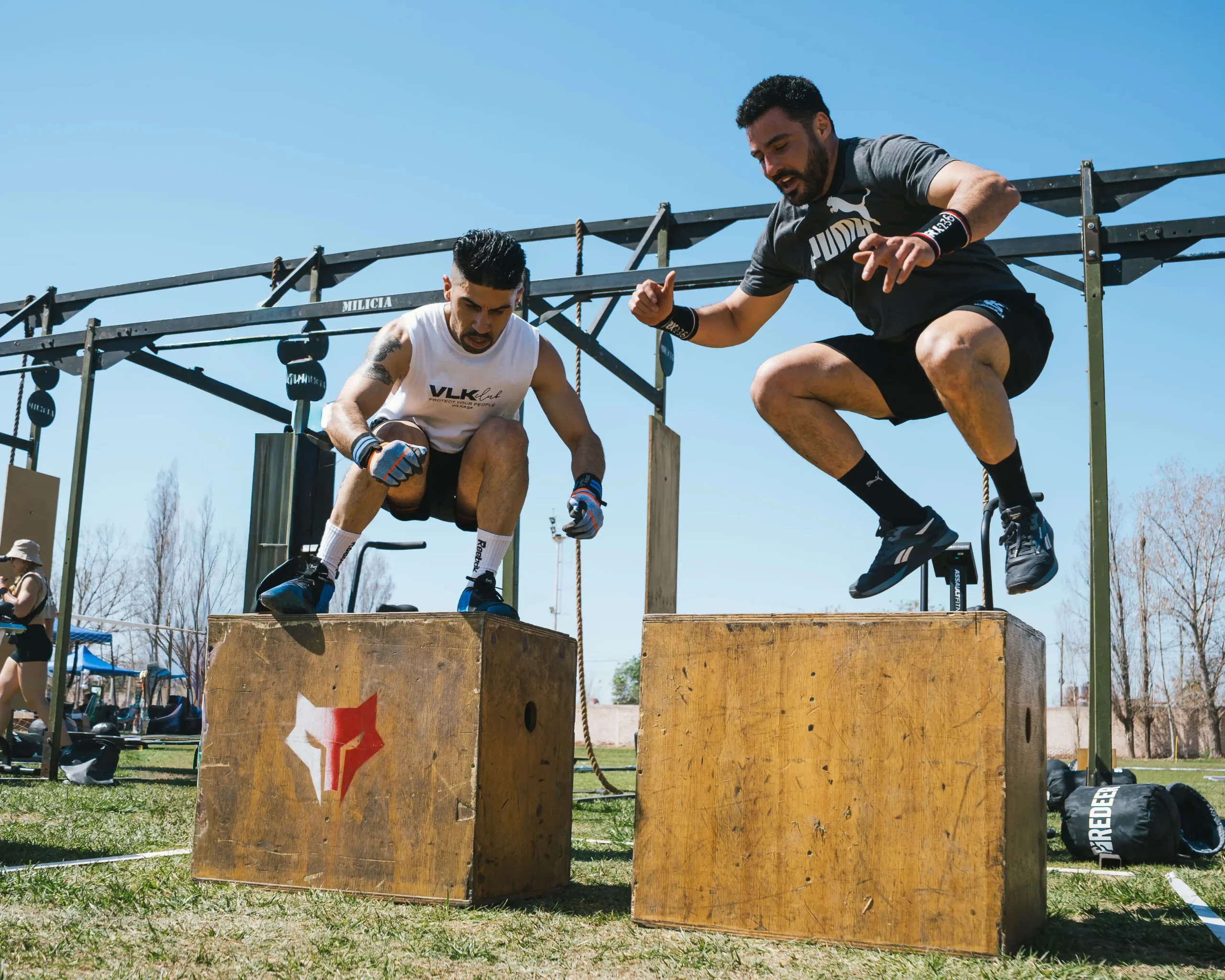 Outdoor CrossFit-style box jump workout used to represent the Roman vs Hims comparison for men's performance and wellness.