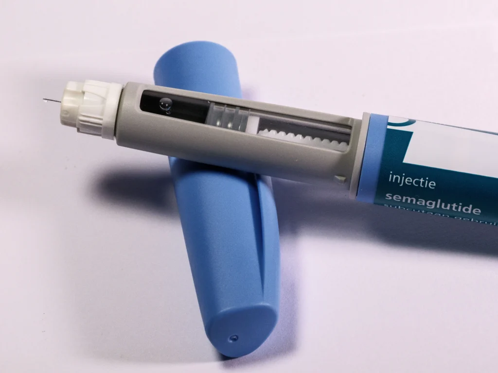 Close-up of a semaglutide injection pen featured in a Hims GLP-1 review