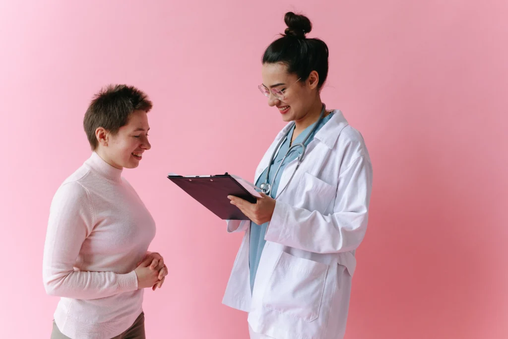 Woman discussing TRT for women with a female doctor during a medical consultation.