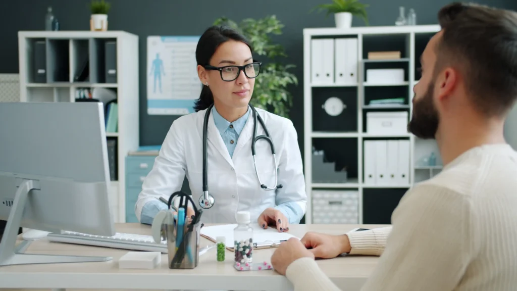 Doctor discussing how to stop TRT safely with a male patient.